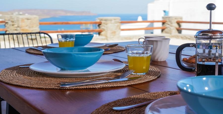 Villa_Sofy_10.jpg Kalafatis Mykonos Dining area, juice, fork, knife, coffee, table, chair, sea, sky, hill, horizon