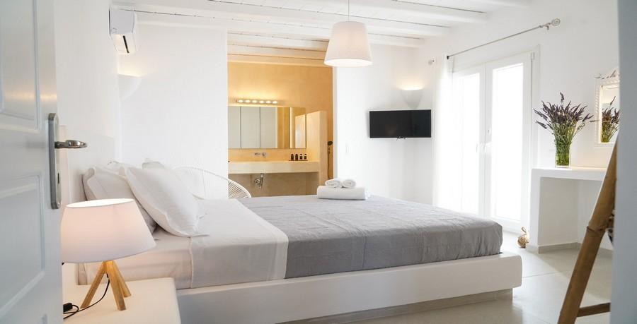 Villa_Sofy_18.jpg Kalafatis Mykonos 3rd Bedroom, bed, flat screen tv, pillows, curtains, lamp