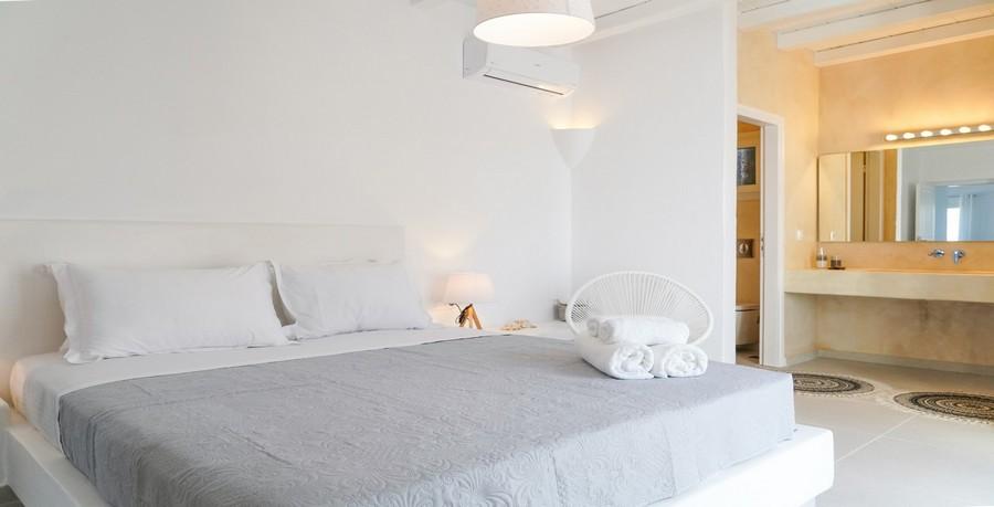 Villa_Sofy_19.jpg Kalafatis Mykonos 3rd Bedroom, bed, pillows, washstand, carpet