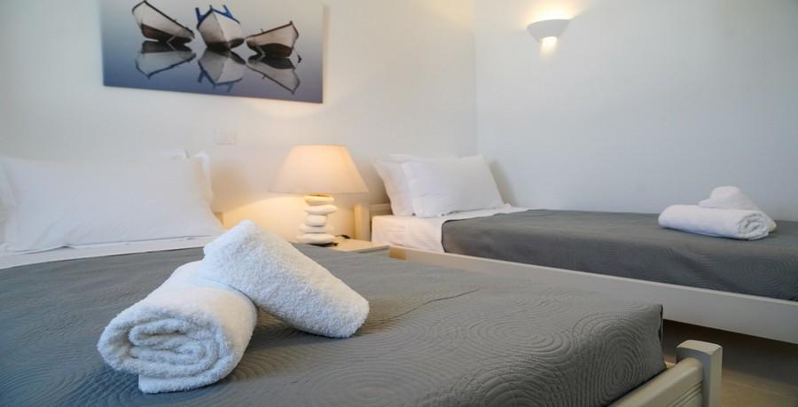 Villa_Sofy_27.jpg Kalafatis Mykonos 2nd Bedroom, paint, lamp, night table, bed, pillows, towels
