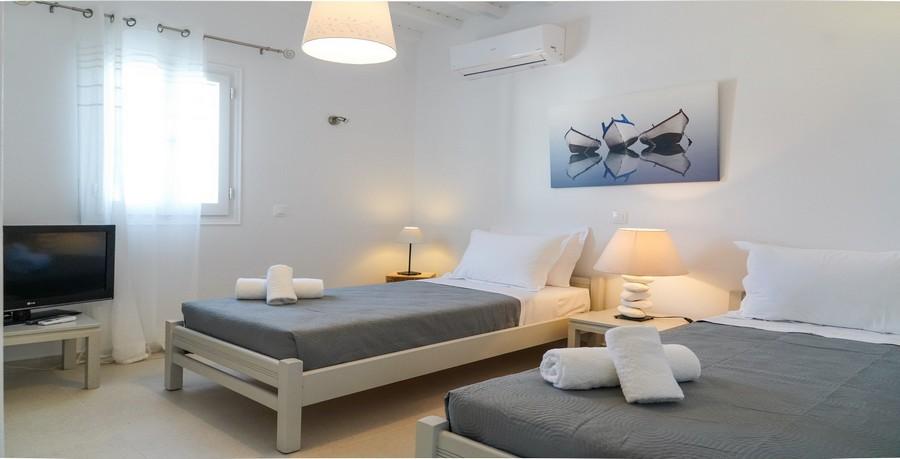 Villa_Sofy_29.jpg Kalafatis Mykonos 2nd Bedroom, bed, pillows, towels, lamp, night table, air condition, paint, flat screen tv, curtains
