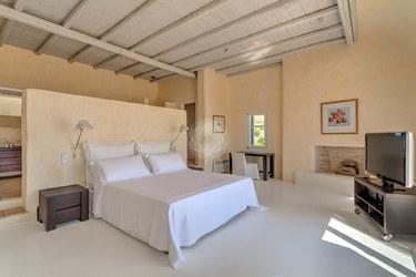 Villa_Stavros_01.jpg Lia Mykonos 3rd Bedroom, bed, pillows, flat screen tv, cabinet