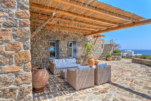 Villa_Stavros_03.jpg Lia Mykonos Outdoor Living area, chairs, table, vase, roof