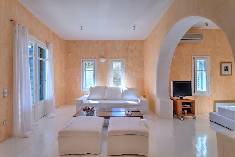 Villa_Stavros_12.jpg Lia Mykonos Living area, flat screen tv, air condition, bed, pillows, curtains