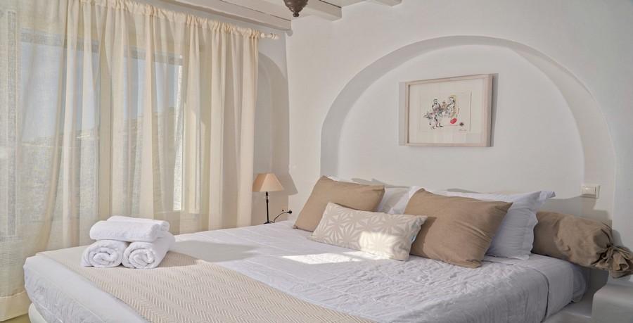 Villa_Tessa_18.jpg Agios Ioannis Mykonos 3rd Bedroom, bed, pillows, towels, lamp, paint, night table, curtains