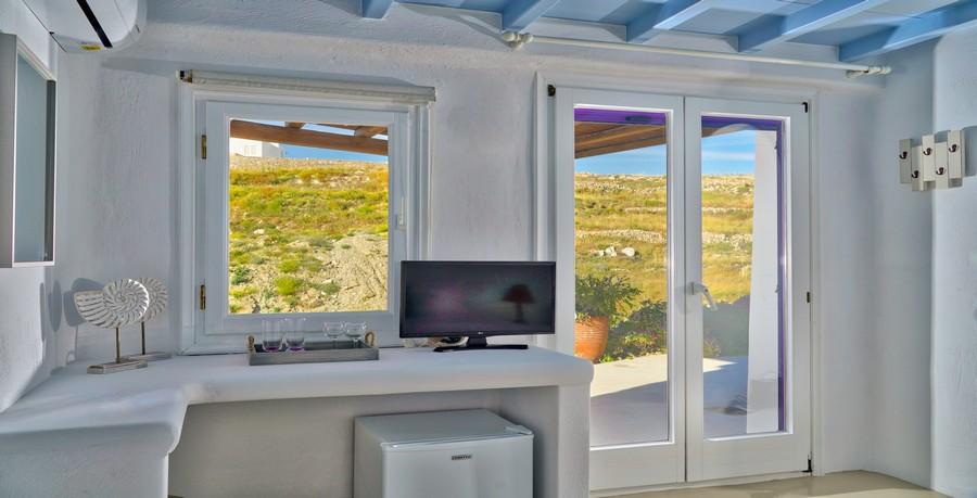 Villa_Tessa_26.jpg Agios Ioannis Mykonos Interior, flat screen tv, table, fridge, air condition, door, window