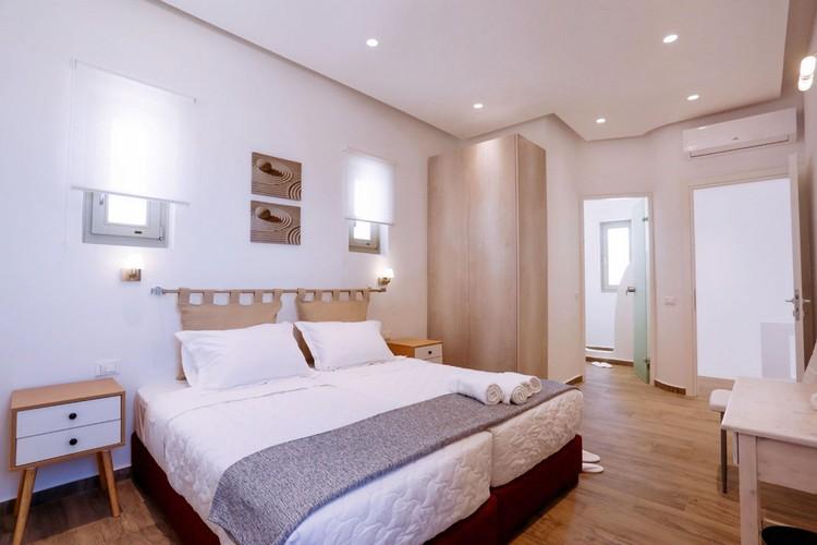 Villa_Yanni_18.jpg Fanari Mykonos 1st Bedroom, bed, pillows, air condition, night table, paint