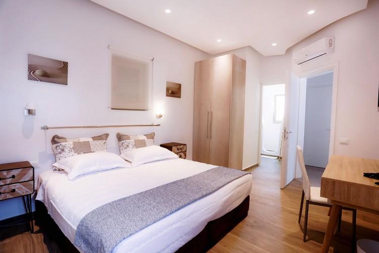 Villa_Yanni_23.jpg Fanari Mykonos 2nd Bedroom, bed, pillows, air condition, night table, lamp
