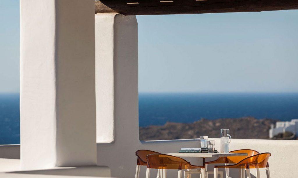 Villa-Agda_21.jpg Agios Ioannis Mykonos, balcony, sea, table, chairs, glass, books