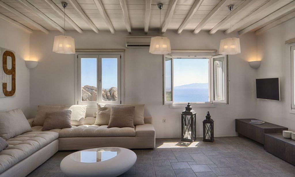 Villa-Agda_23.jpg Agios Ioannis Mykonos, living room, flat screen TV, table, sofa, pillows, windows, AC