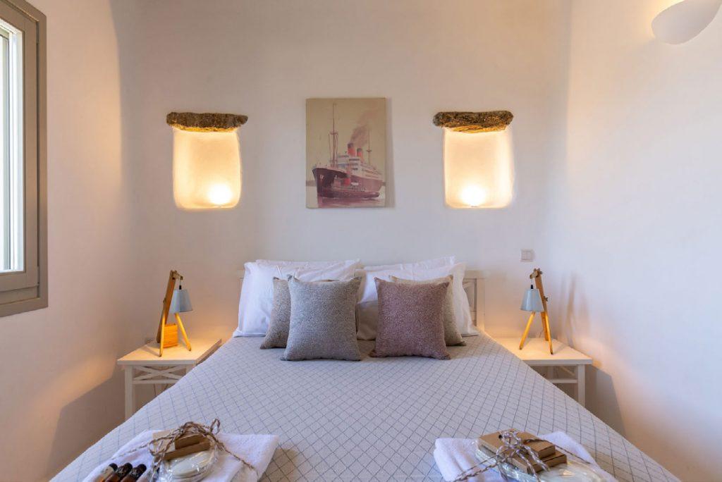 Villa-Camelia_30.jpg Agrari Mykonos, bedroom, bed, painting, nightstands, towels, pillows