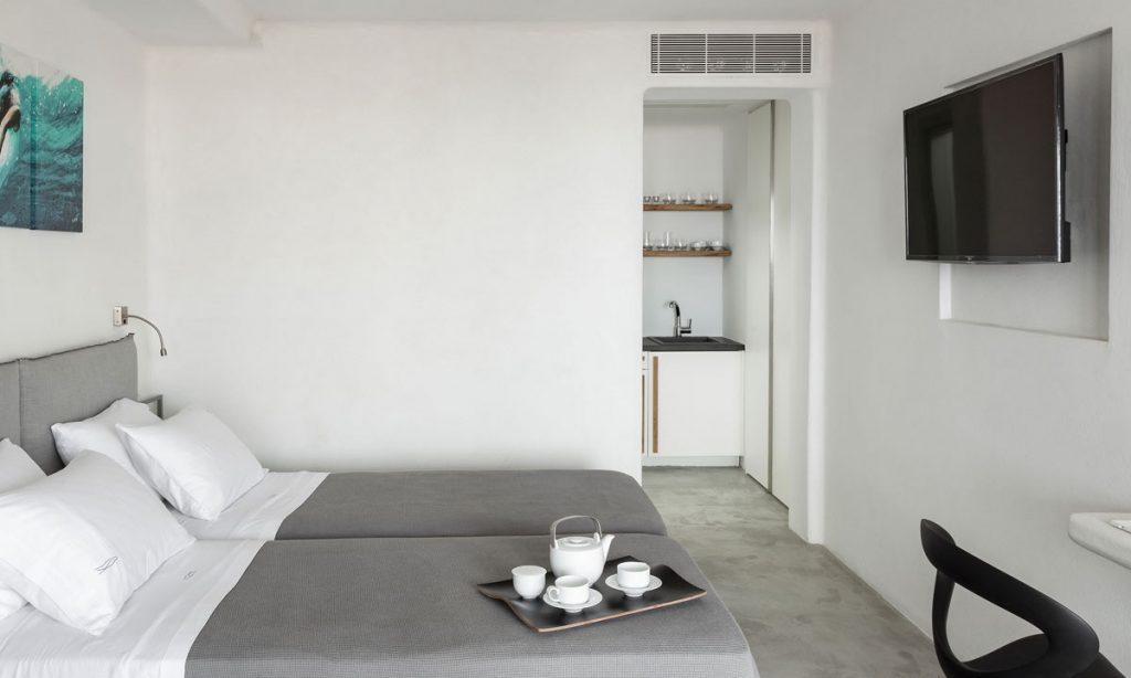Villa-Paige-_35.jpg Elia Mykonos, 2nd bedroom, double bed, painting, flat screen TV, chair, tea set