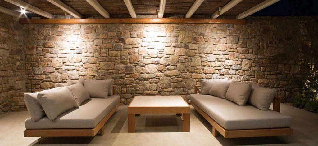 Villa-Rakel_15.jpg Agia Sofia Mykonos, outdoor, sofa, pillows, table, stone wall