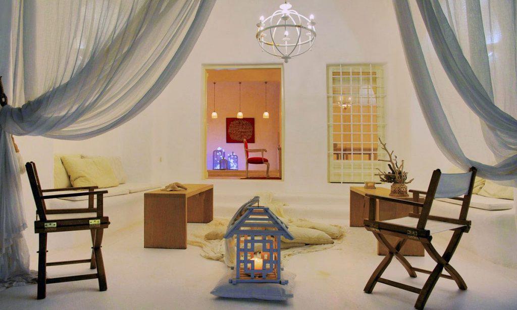 Villa-Ramsey-_13.jpg Halara Mykonos, living room, chairs, table, pillows, sofa, candle, curtains
