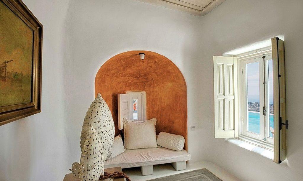 Villa-Ramsey-_21.jpg Halara Mykonos, interior, sofa, pillows, painting, window