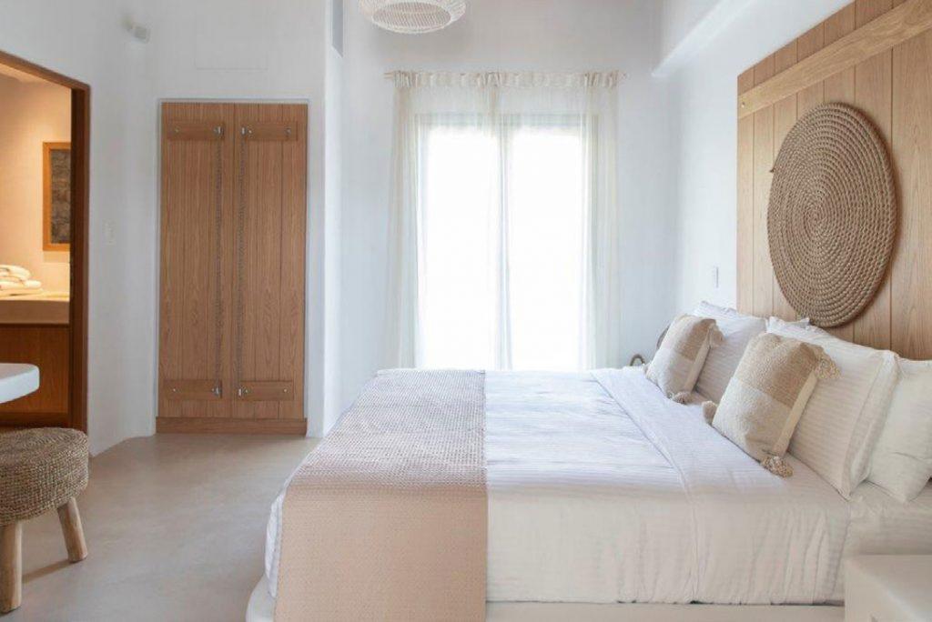 Villa-Sabina_36.jpg Kounoupas Mykonos, 5th bedroom, king size bed, pillows, curtains, closet, chair, nightstand