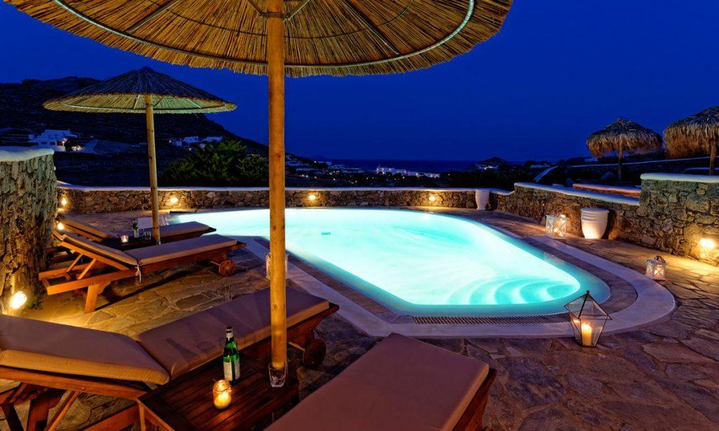 Villa-Valence-_05.jpg Kalafatis Mykonos, outdoor, pool, climbers, umbrellas, night, sky, sea, island, lights