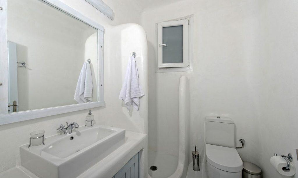 Villa-Valence-_28.jpg Kalafatis Mykonos, 1st bathroom, mirror, washstand, toilet, towel, shower, window, bin