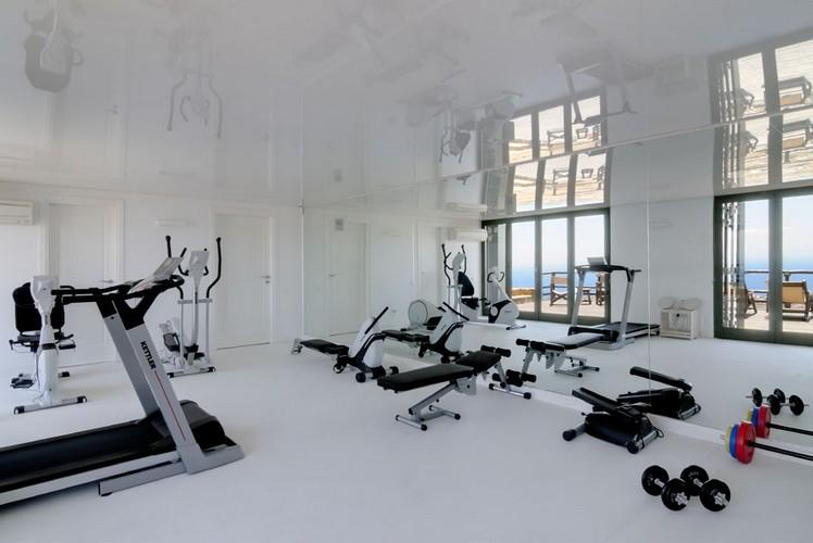 gym with huge mirrors and equip for training