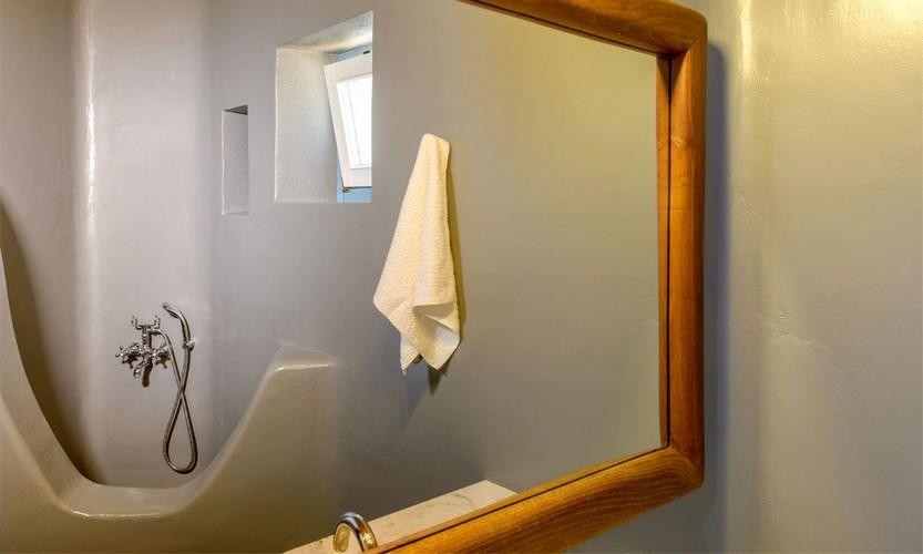 simply designed bathroom with huge mirror