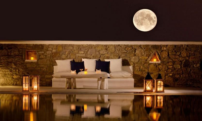 Villa_Patricia_19.jpg Super Paradise Mykonos Outdoor Living area, bed, pillows, pool, candle, moon