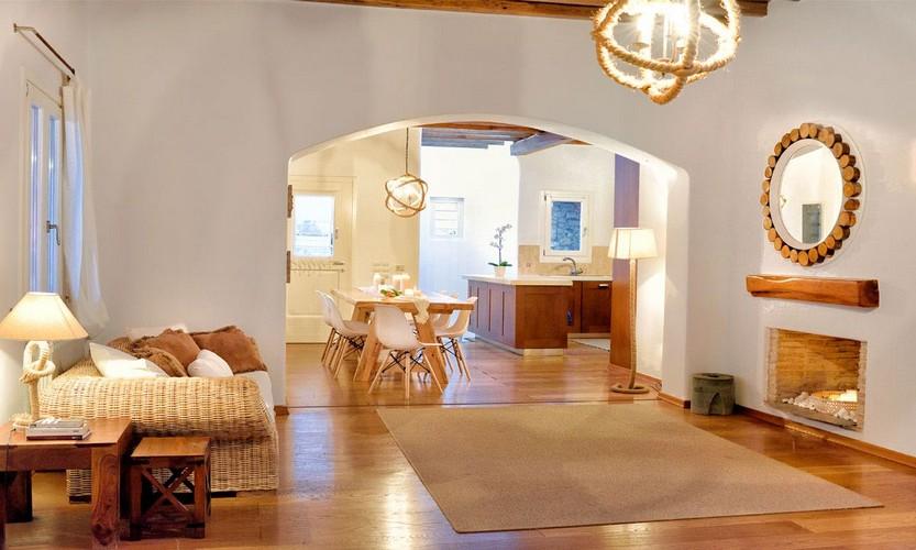 Villa_Patricia_24.jpg Super Paradise Mykonos Living area, carpet, fireplace, mirror, bed, pillows, chairs