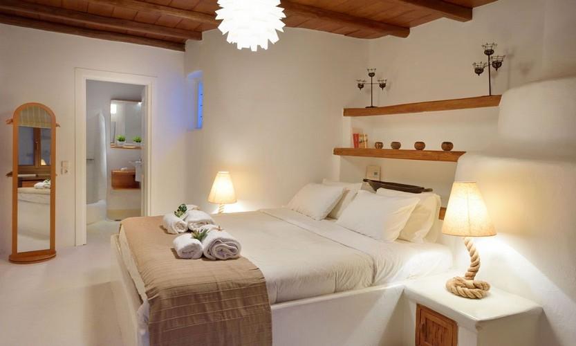 Villa_Patricia_33.jpg Super Paradise Mykonos 4th Bedroom, shelf, bed, pillows, lamp, mirror