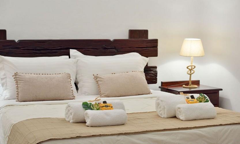 Villa_Patricia_38.jpg Super Paradise Mykonos 1st Bedroom, bed, pillows, towels, lamp, night table