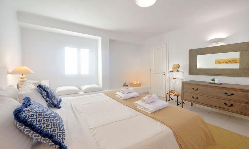 Villa_Patricia_41.jpg Super Paradise Mykonos 5th Bedroom, mirror, bed, pillows, towels, door