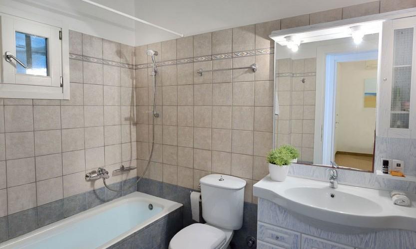Villa_Patricia_48.jpg Super Paradise Mykonos 1st Bathroom, bath, mirror, washstand, lamp, towel rack