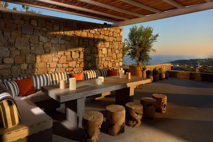 outdoor dining area with stunning horizon view and sunset