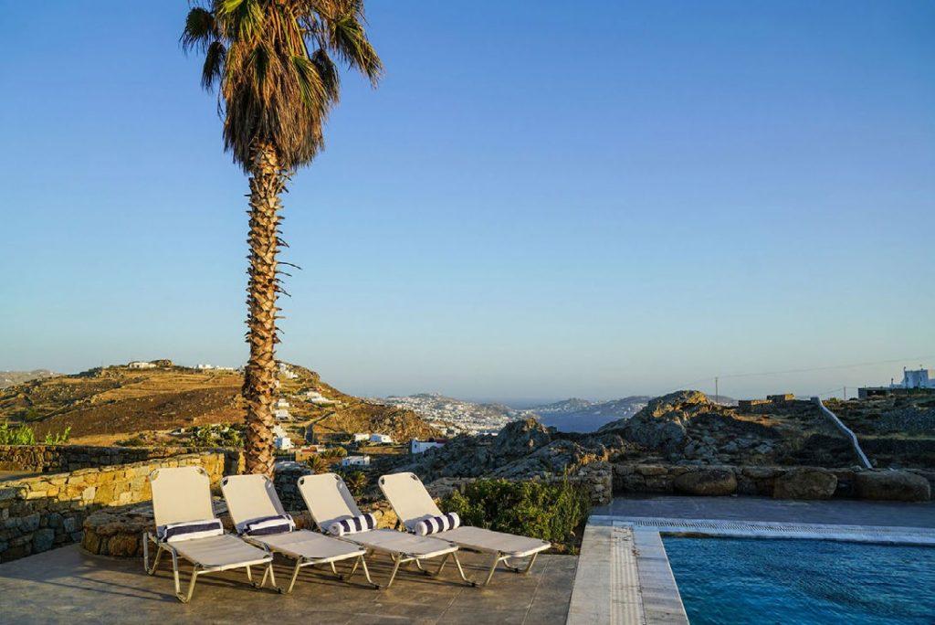 Villa Umabel, Agios Stefanos, Mykonos, Swimming pool, Pool, Stone wall, Sky, Sunbeds