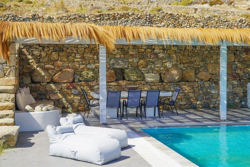 Villa Umabel, Agios Stefanos, Mykonos, Swimming pool, Pool, Stone wall, Balcony, Chairs, Lazy bag, Sky