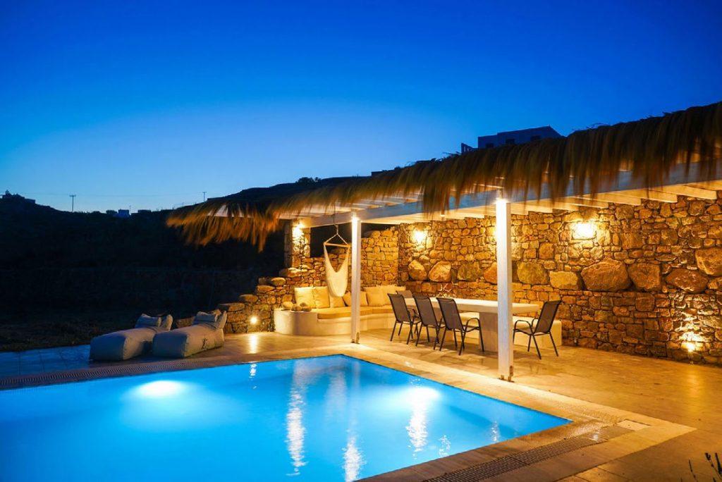 Villa Umabel, Agios Stefanos, Mykonos, Swimming pool, Pool, Stone wall, Balcony, Chairs, Lazy bag, Sky