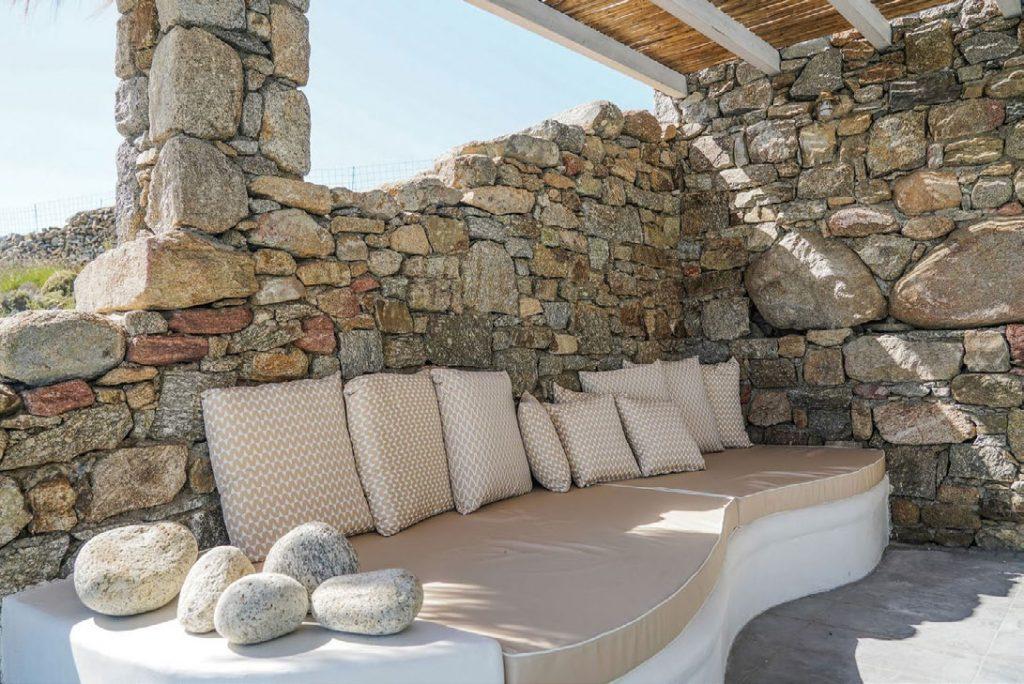 Villa Umabel, Agios Stefanos, Mykonos, Stone wall, Pillows, Stone, Sofa, Sky, Plants