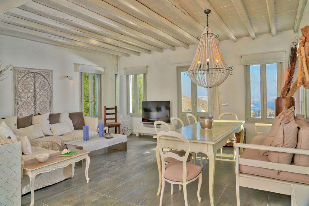 Villa Umabel, Agios Stefanos, Mykonos, Windows, Chairs, table, Sofa, Pillows, Lamp, Dinning room, Living room, Flatscreen TV