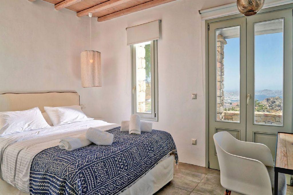 Villa Umabel, Agios Stefanos, Mykonos, Sleeping room, Pillows, Towels, Windows, Sky, Picture, Bed, Lamp
