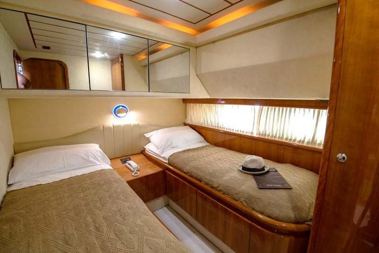 Yacht_Ananas_07.jpg Mykonos 1st Bedroom, bed, pillows, hat, curtains, door