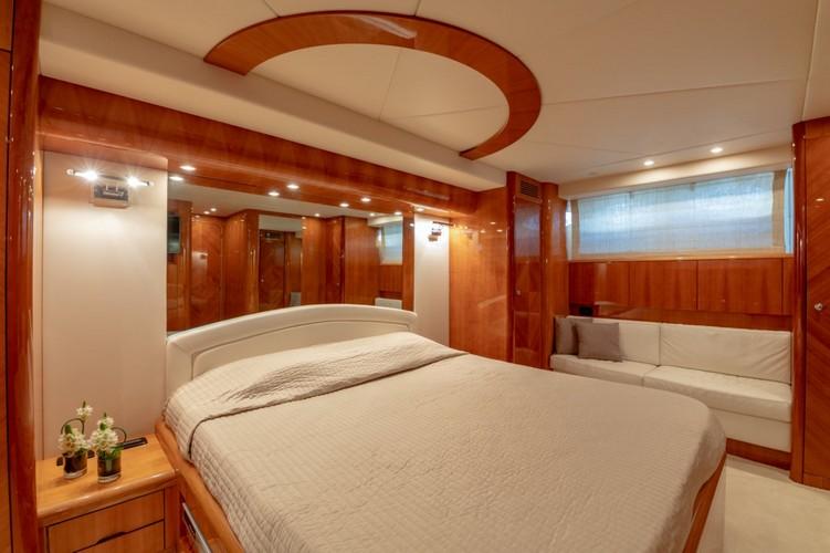 Yacht_VenusSecret_10.jpg Mykonos 3rd Bedroom, bed, pillows, cabinet, flowers