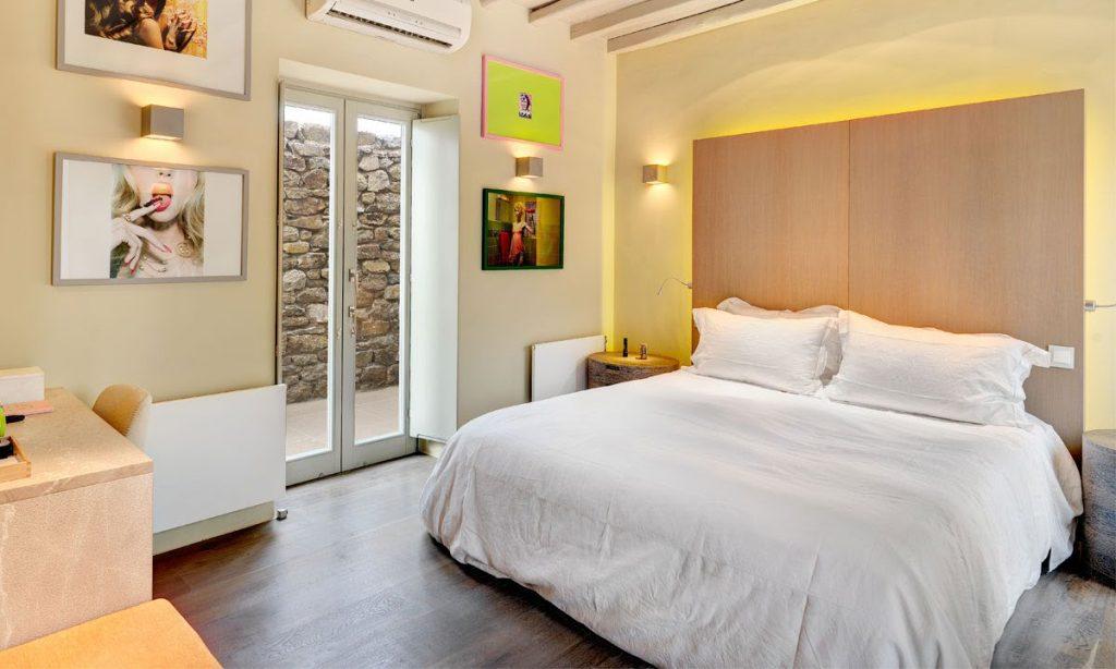 Villa Raisa Super Paradise Mykonos, 5th bedroom, king size bed, nightstands, desk, AC, paintings, lamps