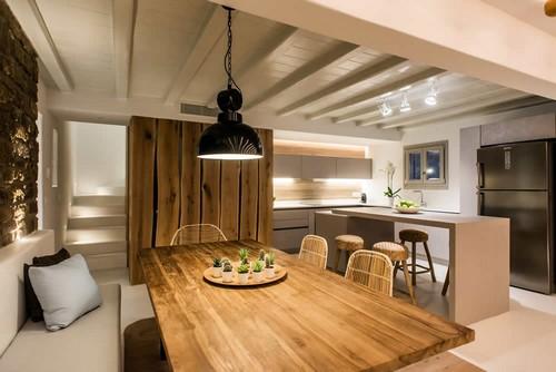 Villa_Levi_07.jpg Chora Mykonos Dining area, table, stairs, pillows, chairs, fridge, bar