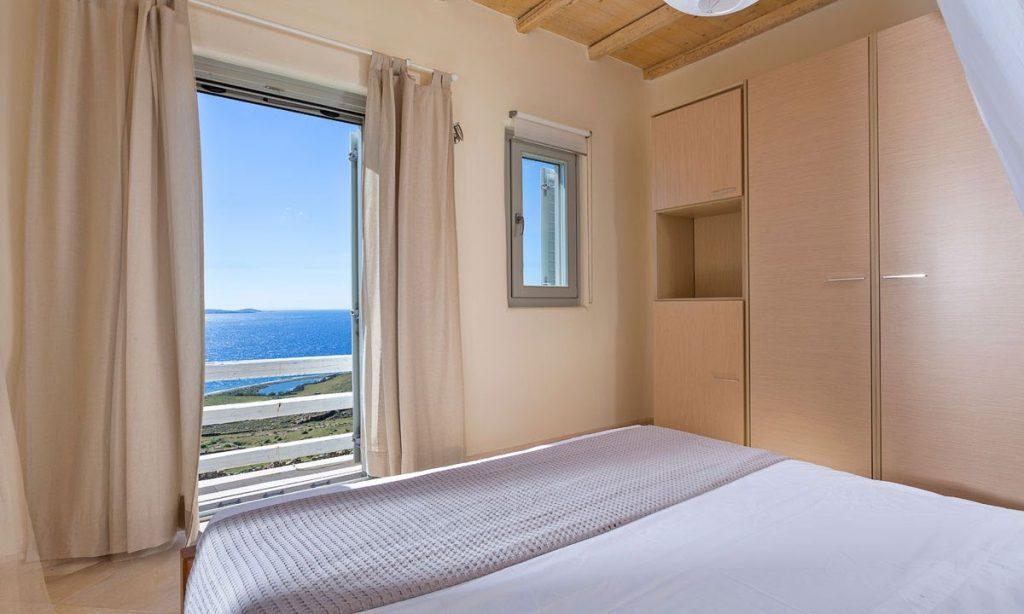 Villa Orion Retreat, Houlakia, Mykonos, bedroom, king size bed, blanket, closet, door, curtains, window, sea, view