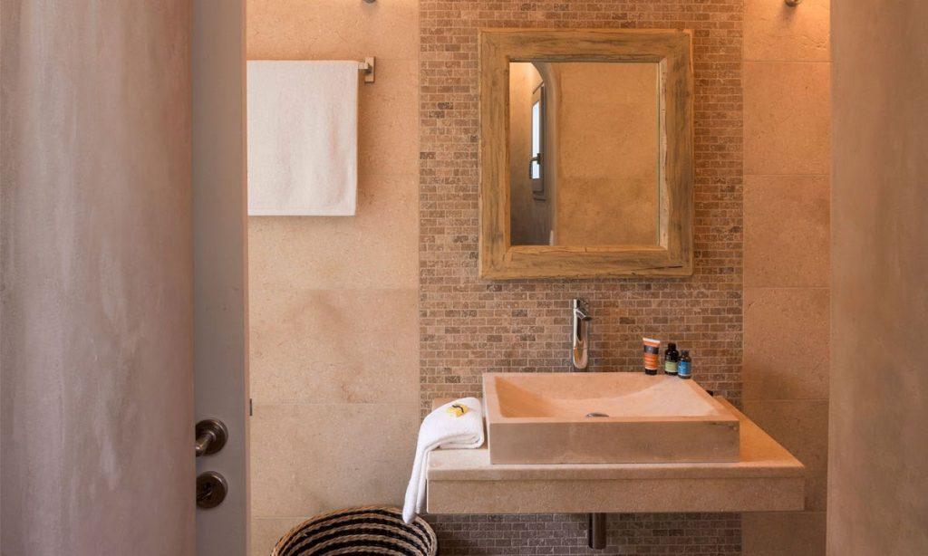 Villa Orion Retreat, Houlakia, Mykonos, bathroom, washstand, mirror, towel, basket, door