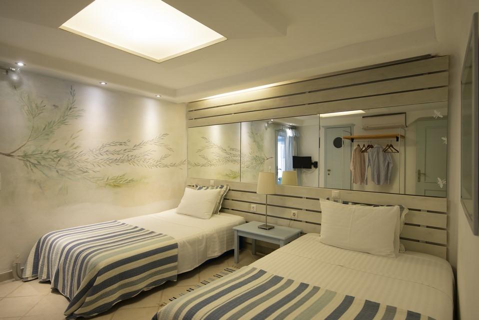 bedroom covered with mirrors and wall lamps for better light
