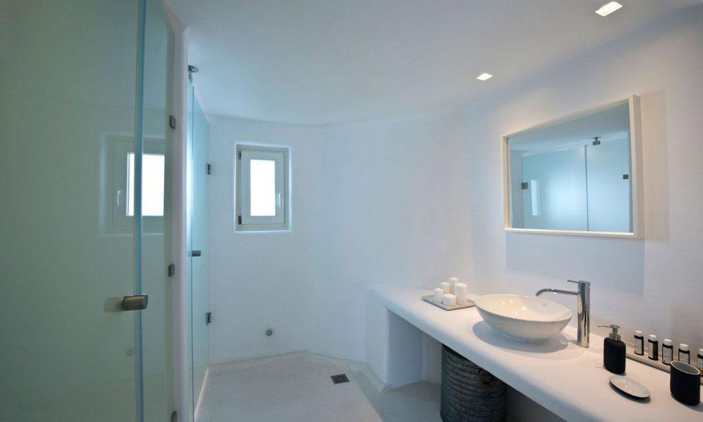 white luxurious bathroom with shower and mirror