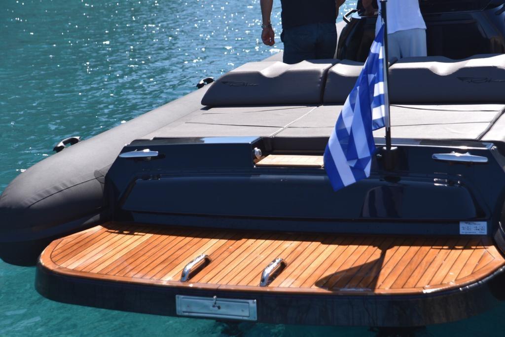yacht with wooden deck and flag