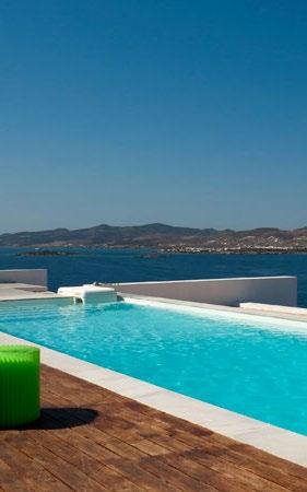 hill slope villa overlooking mesmerizing blue Mykonos sea
