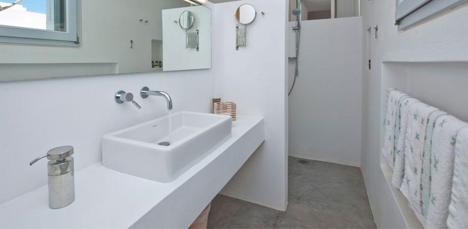 big mirror and extensive sink to get ready and take a shower before daily activities