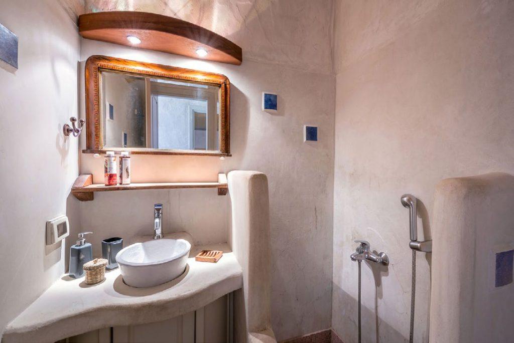 minimalistic designed bathroom with elevated ceramic sink
