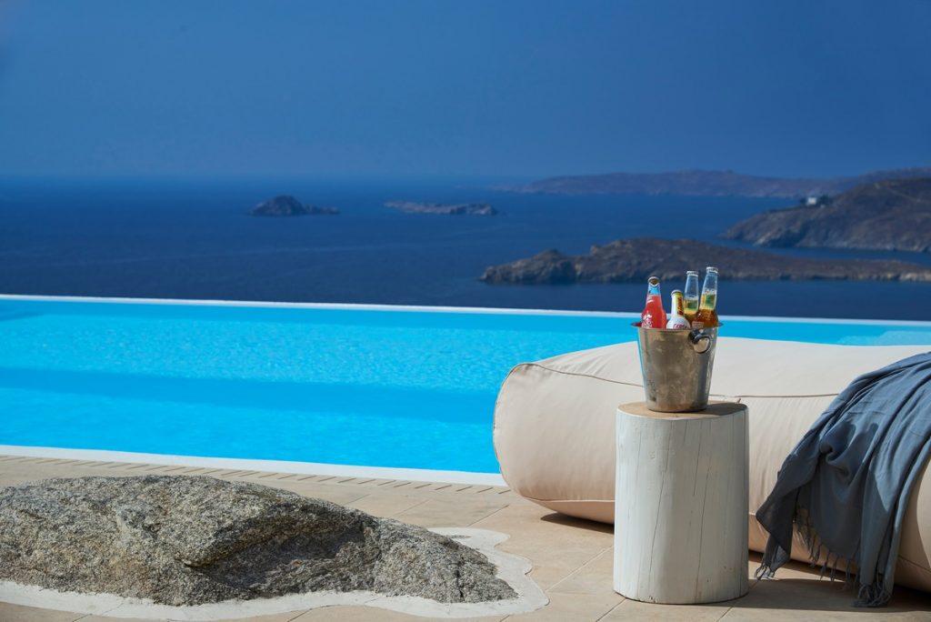 area for enjoying the beautiful view of the blue sea from the pool with a refreshing drink